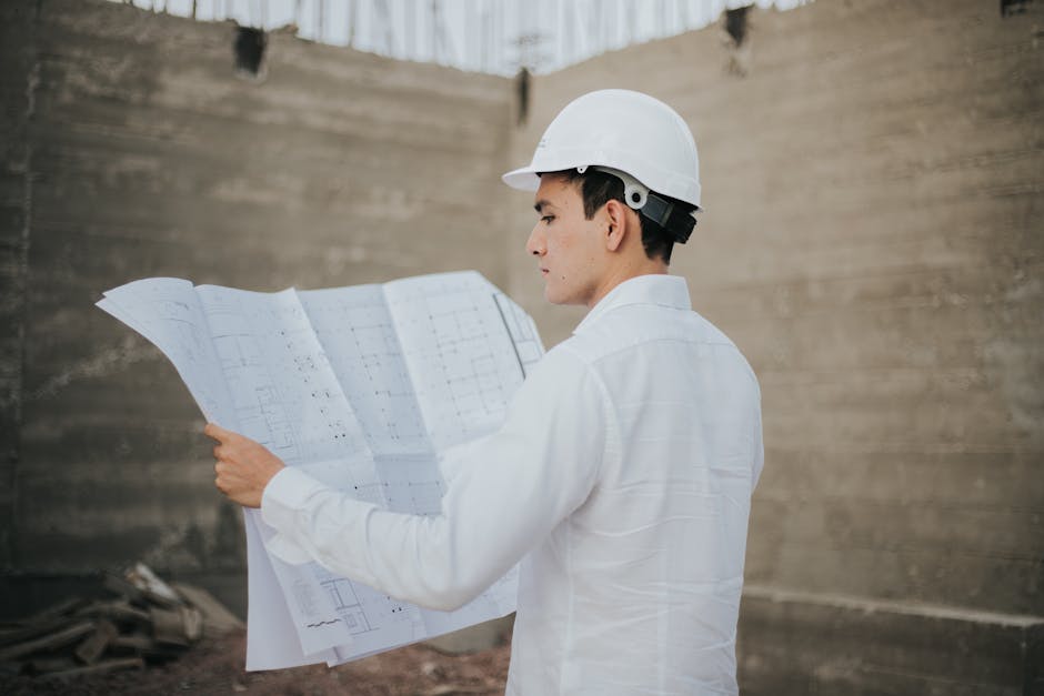 Contractor reviewing blueprints for a home renovation